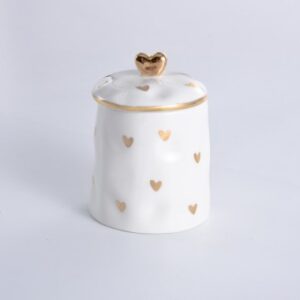 small white sugar jar with gold heart pattern