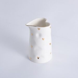 White heart shape creamer pitcher with small gold hearts