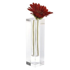 rectangular crystal vase that holds a single flower